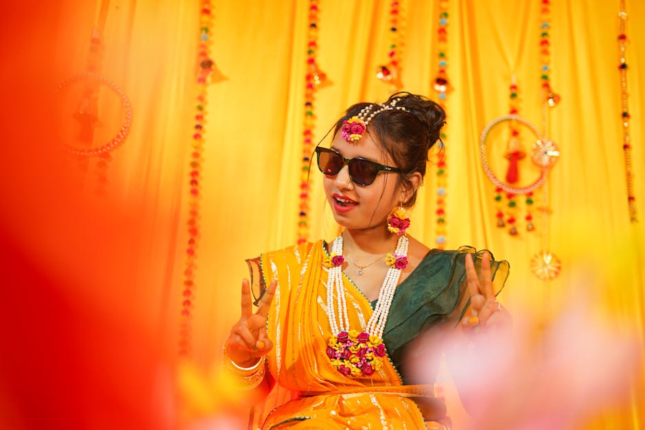 A joyful Indian bride adorned in traditional attire during a colorful Haldi ceremony.